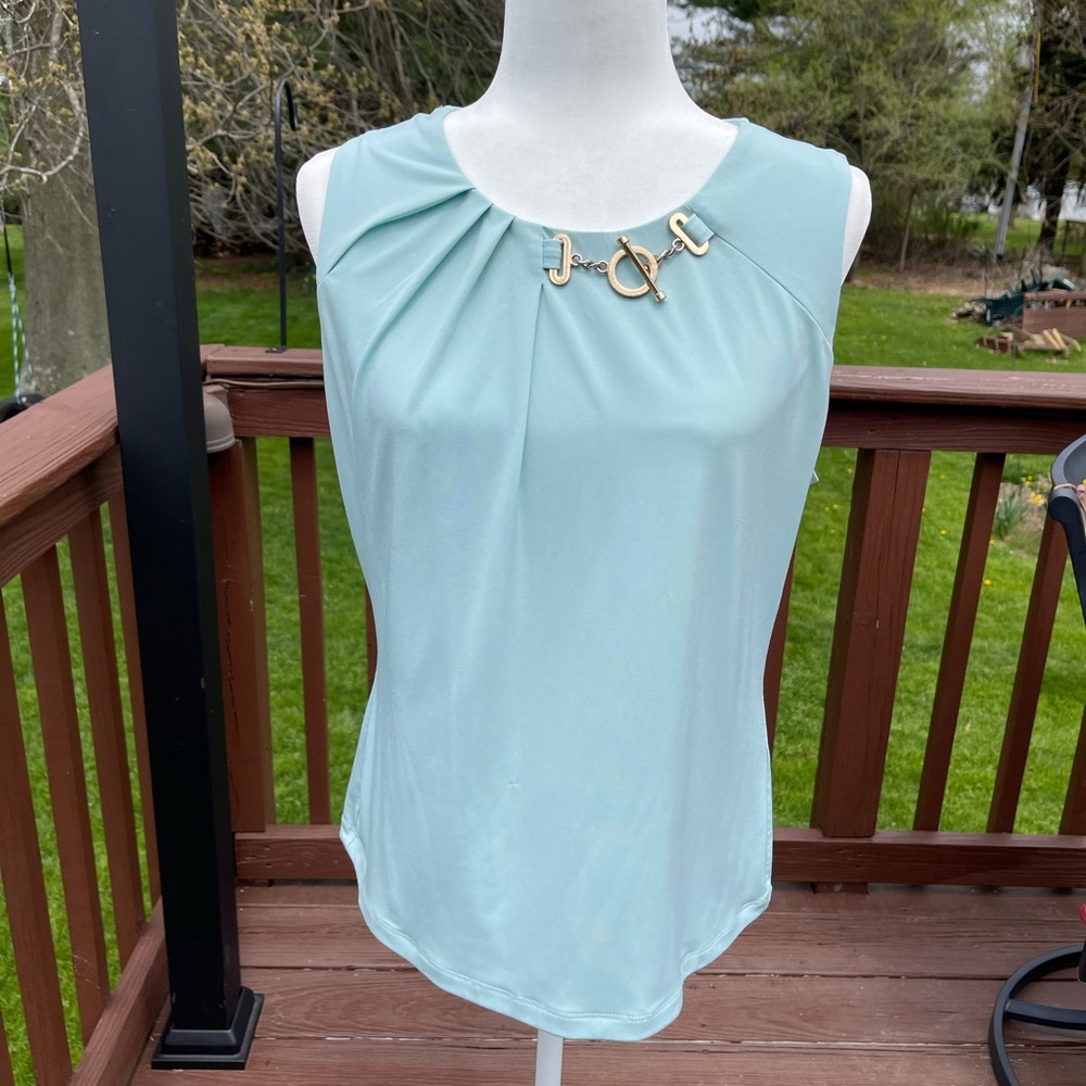 Ivanka Trump aqua blouse